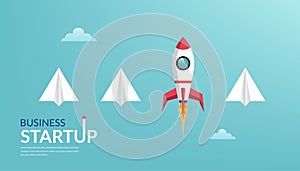 Business startup launching products with rocket symbol. Successful business startup. Creative and unique business idea among paper