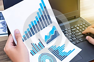 business statistics success concept : businessman analytics financial chart and graph