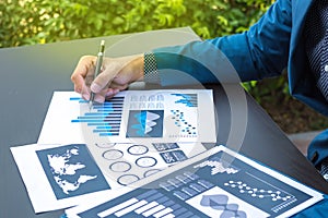 business statistics success concept : businessman analytics financial chart and graph