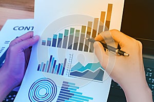 business statistics success concept : businessman analytics financial chart and graph