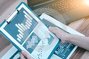 business statistics success concept : businessman analytics financial chart and graph