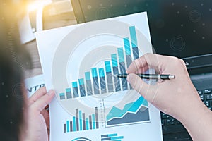 business statistics success concept : businessman analytics financial chart and graph