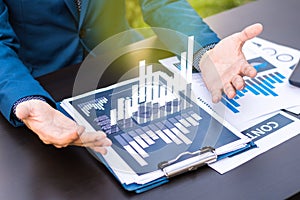 business statistics success concept : businessman analytics financial chart and graph