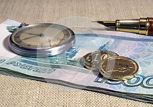 Business still-life with money and watch