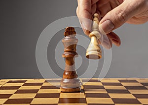 Business strategy concept. Knight making final last step to make checkmate in chess, falling king