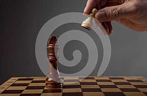 Business strategy concept. Pawn making final last step to make checkmate in chess