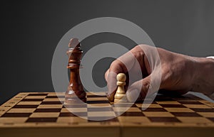 Business strategy concept. Pawn making final last step to make checkmate in chess