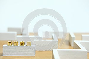 Business strategy conceptual photo â€“ wooden beads word Plan above labyrinth maze