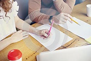 Business Student meeting in office, close-up of woman man hands writing on paper sheet, empty space for layout. Stationary on wood