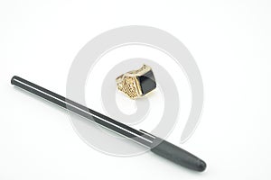 Business style. Isolated pen and finger ring from best gold