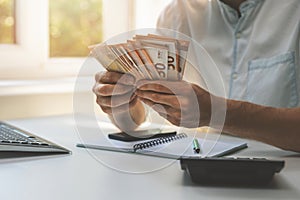 Business success - businessman counting cash money