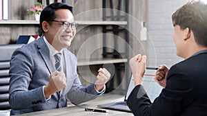 Business success corporate, Asian businessmen smiling and arms up after success job with partner, Happy business team rise hand