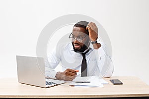 Business and success. Handsome successful African American man wearing formal suit, using laptop computer for distant