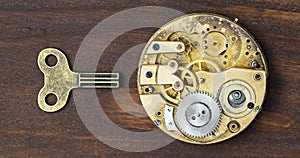 Business success and leadership concept, solution key with vintage watch mechanism