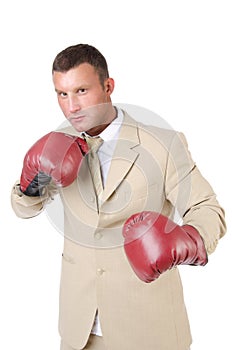 Business and success. Office fight. Young man in boxing gloves. Work and the battle. White background