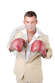 Business and success. Office fight. Young man in boxing gloves. Work and the battle. White background