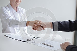 Business success, portraying male businessmen working with women to show their willingness to join together, Handshake to connect