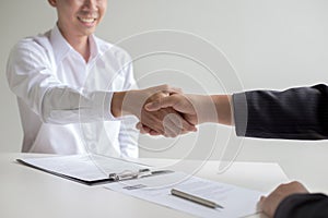 Business success, portraying male businessmen working with women to show their willingness to join together, Handshake to connect