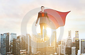 Business super hero hover over city skyline