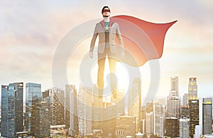 Business super hero hover over city skyline