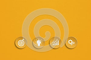 Business symbol on grunge circle yellow paper cut with copy space for target, development, growing business concept