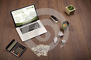 Business table with notebook computer and office accessories