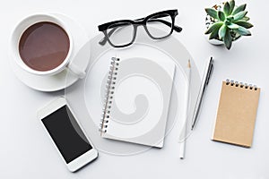 Business table top with mock up office supplies on white