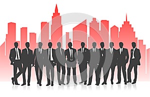 Business team against the background of a bright silhouette of the city.