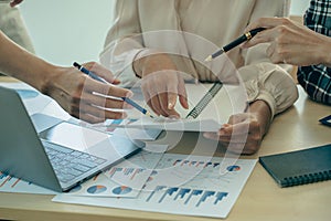 Business team analyzing data using computer while spending time in office Financial planning,