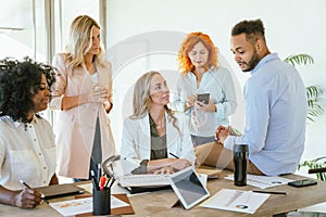 Business team analyzing graphs and data while having a meeting in the office