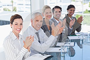 Business team applauding during conference