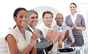 A business team applauding a presentation