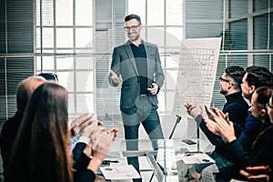 Business team applauds the speaker at the business presentation