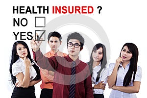 Business team approving health insured