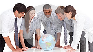 Business team around a terrestrial globe