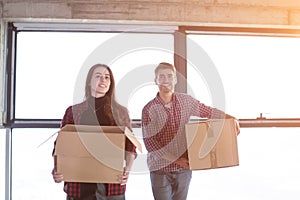 Business team carrying cardboard boxes