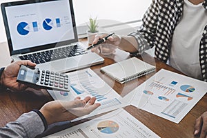 Business team casual collaboration discussing working analysis with financial data and marketing growth report graph in team,