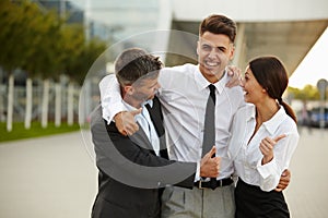 Business Team Celebrating a Deal. Thumbs up