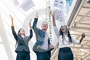 Business team celebrating success. Business people throwing paperwork to the sky celebrate after project is done successfully