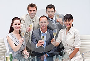 Business team celebrating success with champagne