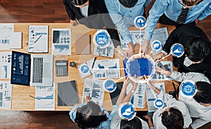 Business Team Collaboration on Data Analysis with Charts, Graphs, and Technology Illustrations in an Office Setting