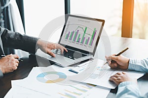 Business team collaboration discussing working analyzing with financial data and marketing growth report graph in team,