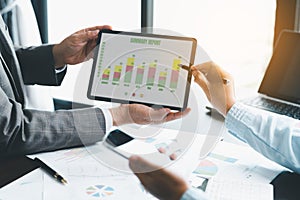 Business team collaboration discussing working analyzing with financial data and marketing growth report graph in team,