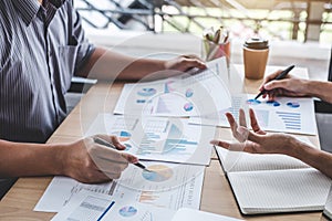 Business team colleagues discussing working analysis with financial data and marketing growth report graph in team, Meeting