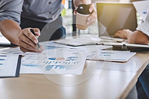 Business team colleagues discussing working analysis with financial data and marketing growth report graph in team, Meeting