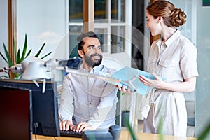 Business team with computer and files in office