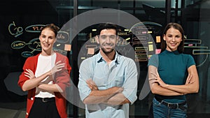 Business team crossing arms while standing together at glass wall. Tracery