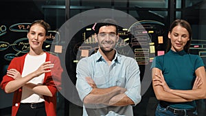 Business team crossing arms while standing together at glass wall. Tracery