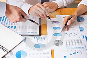 Business team data analyzing income charts document during discussion explain strategy meeting. on start-up project teamwork