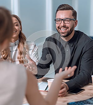 Business team discussing business issues over a Cup of coffee